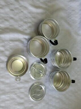 Set of vintage stainless steel coffee filters and cups circa 1940